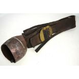 A 19th century cowbell on heavy leather strap,