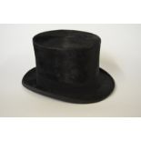 A black silk top hat retailed by Fournisseur de S. M.