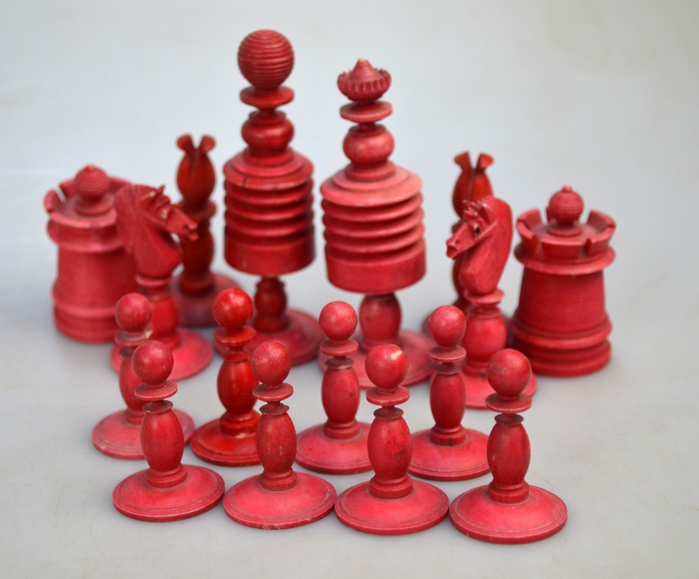 A 19th century ring-turned bone chess set with red dye, king 9. - Image 2 of 4