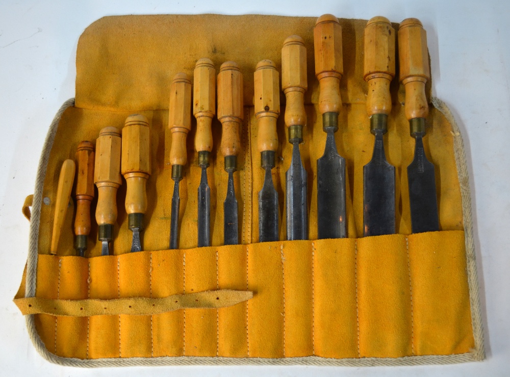 A graduated set of twelve 19th century turning-chisels with turned and octagonal-carved wood