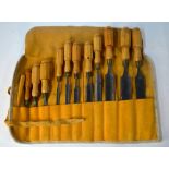 A graduated set of twelve 19th century turning-chisels with turned and octagonal-carved wood