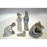 Five Lladro models including a Sleeping child; Resting girl with basket of vegetables;