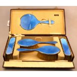 A cased five-piece silver and basse-taille blue enamel brush set, Levi & Salaman,