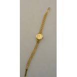 A lady's 9ct gold Rotary wristwatch with quartz movement, on fancy-link fracelet, Birmingham 1982,