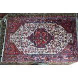 A Persian Hamadan rug, the cream ground