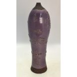 A lavender glazed stoneware baluster vas