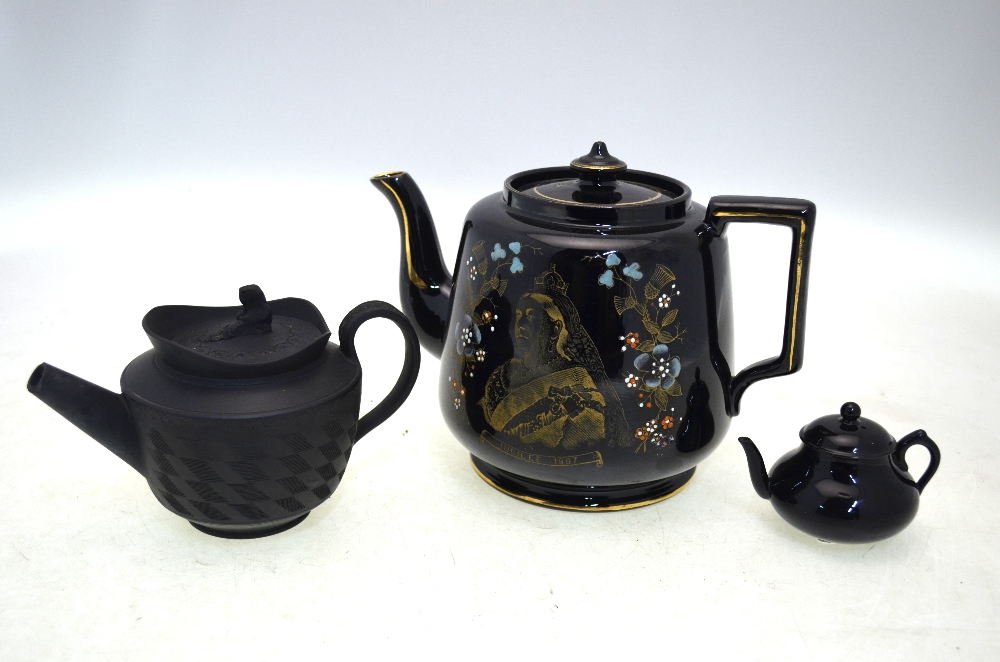 Three black teapots, comprising: an 1887