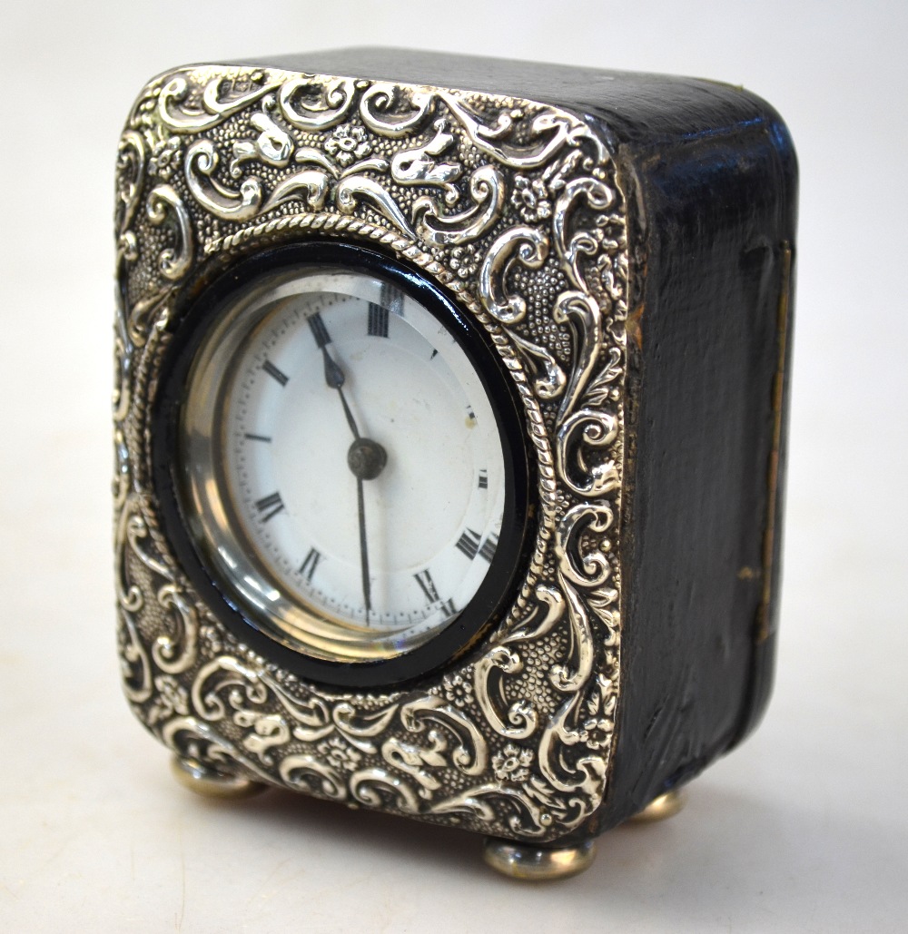 An Edwardian leather-cased desk clock with embossed silver face, Birmingham 1904, - Image 5 of 5