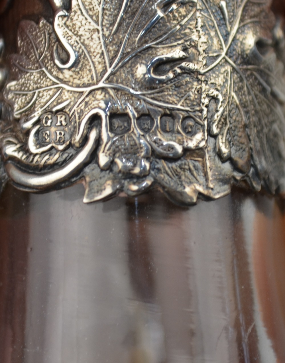 A Victorian glass wine bottle with wheel-etched vine decoration and vine-embossed silver collar and - Image 3 of 4