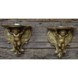 A pair of giltwood brackets, modelled with cherubs,