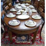A Regency style mahogany extending dining table,