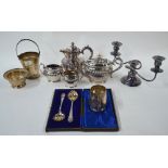 A Walker & Hall electroplated four-piece tea service including hot water jug, to/w a square tray,