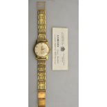 A gentleman's 9ct gold wristwatch by Garrard of Regent St.