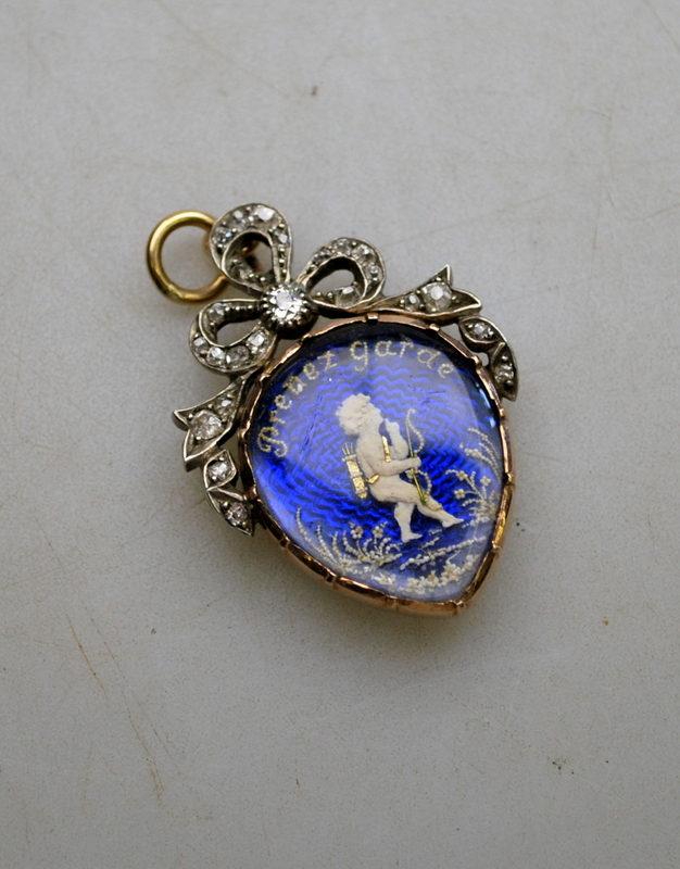 A Georgian heart-shaped pendant featuring Cupid amongst flowers on a blue enamelled background, - Image 3 of 3