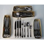 A set of stainless steel flatware and cutlery for twelve - apparently unused