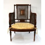 An Edwardian Sheraton Revival polychrome decorated satinwood bergere armchair,