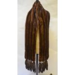 A dark brown shadowed mink stole with six tail embellishments to ends