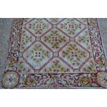 An antique decorative shabby chateau antique needlepoint woven in four co-joined panels,