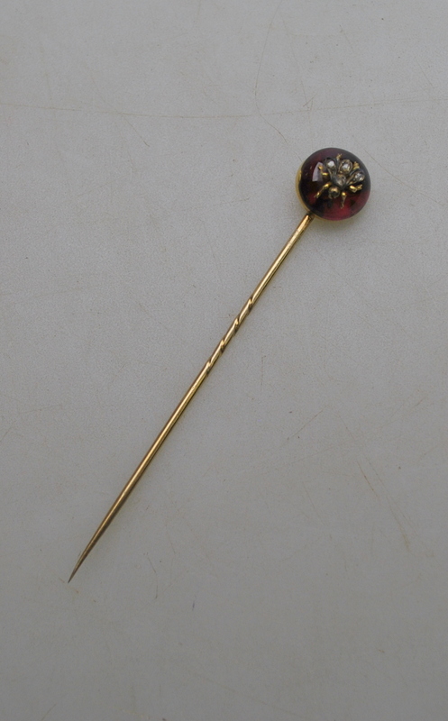 A Victorian stick pin of circular almandine garnet with diamond set bee in centre, - Image 2 of 4