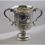 A George III silver loving cup with twin scroll handles, on stemmed circular foot,