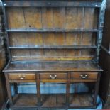 An 18th century oak and pollard oak cottage dresser,