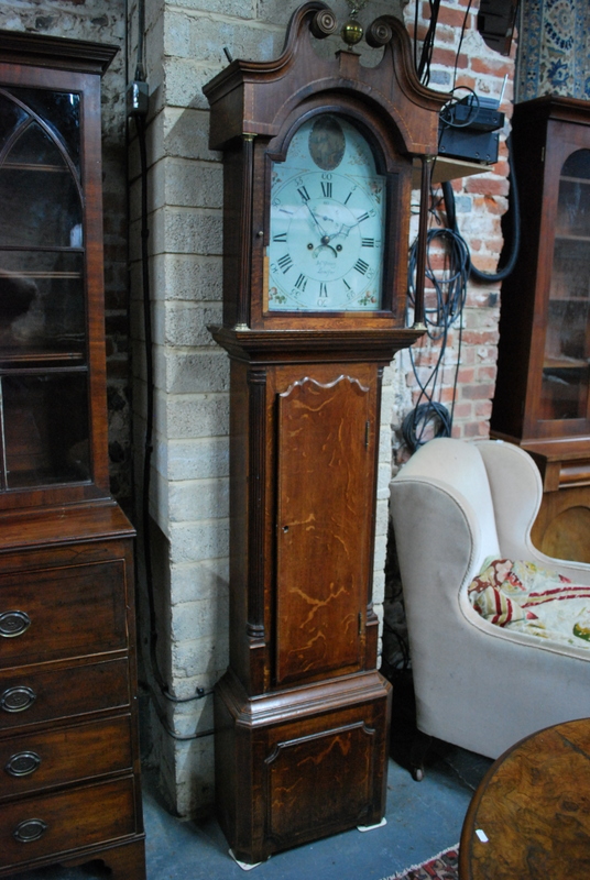 A Victorian cross-banded oak longcase clock,