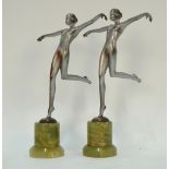 Two small Art Deco period silver-patinated bronze nude dancing girls in the manner of Lorenzl,