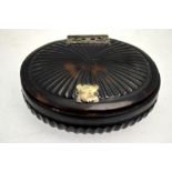 A 18th century continental tortoiseshell oval snuff box with ornate white metal hinges,