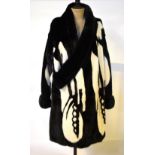 A Christian Dior Boutique, Paris black and white mink coat styled with striking abstract design,