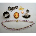 A graduated oval amethyst riviere necklace in gilt metal claw setting to/w niello plaque bracelet,