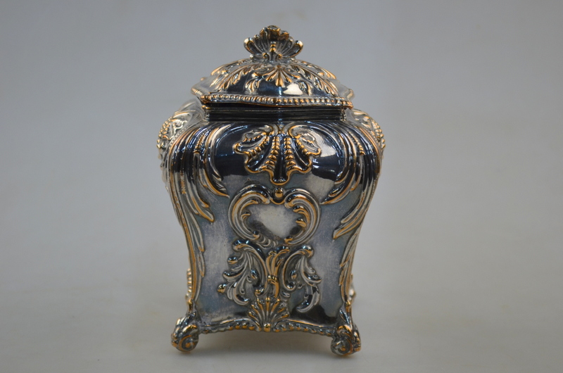 A Georgian Rococo style Old Sheffield Plate tea caddy and cover of square baluster form with