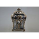 A Georgian Rococo style Old Sheffield Plate tea caddy and cover of square baluster form with