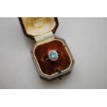 An oval zircon and diamond cluster ring,