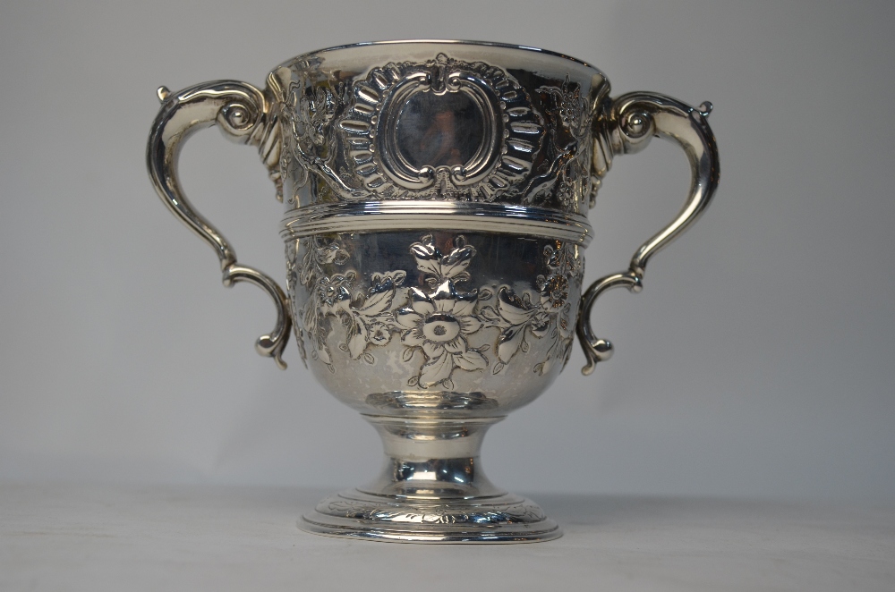 A 19th century two-handled loving cup in the Georgian manner, embossed with vines and rose garlands, - Image 2 of 5