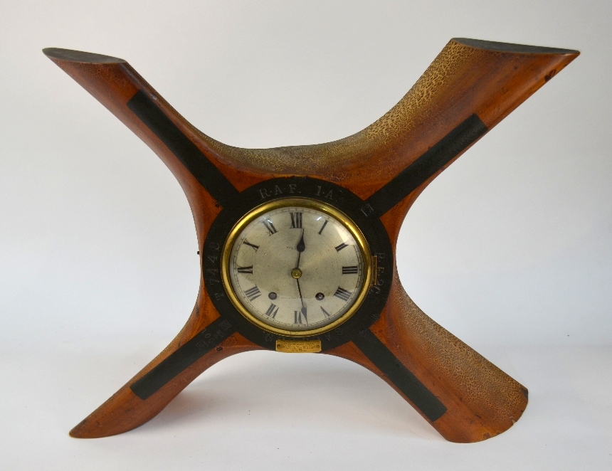 A cut-down four blade WWI propeller boss mounted with an 8-day clock,