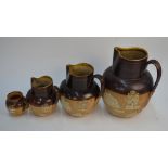 Three Royal Doulton graduated harvest jugs, 11 cm - 20 cm to/w a similar smaller example, 6.