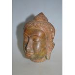 WITHDRAWN A Sino-Tibetan bronze cast Buddha's head, the surface showing much degradation,