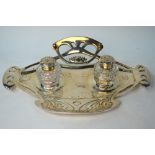 A German Art Nouveau style electroplated inkstand fitted with two cut glass bottles, 37 cm wide,