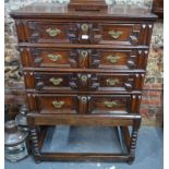 A late 17th/18th century oak joined chest on stand,