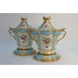 A pair of oval Ridgway twin handle vases and covers with separate base in the Sevres style, c.