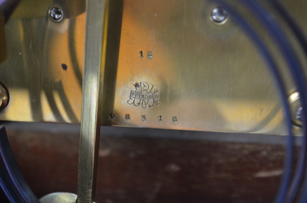 An early 20th century walnut cased eight-day mantel clock with silvered dial incorporating a - Image 4 of 5