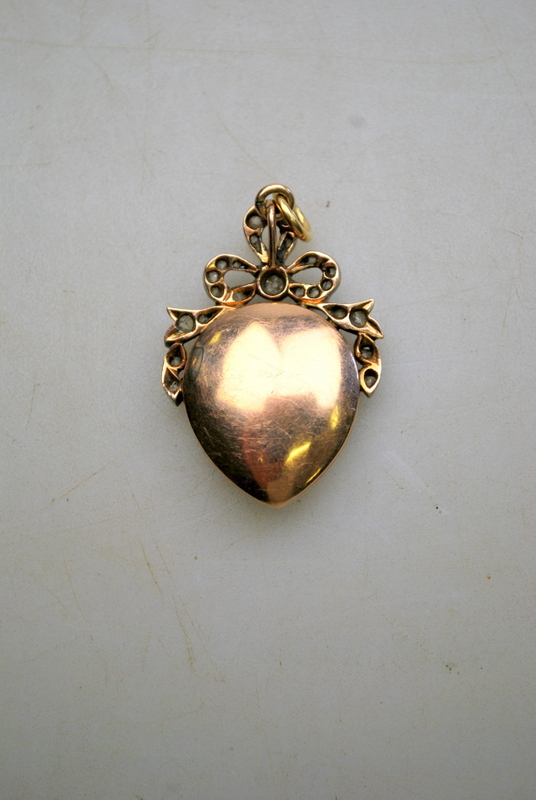 A Georgian heart-shaped pendant featuring Cupid amongst flowers on a blue enamelled background, - Image 2 of 3