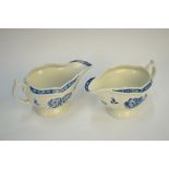 A pair of First Period Worcester strap fluted sauce boats with embossed panels painted in