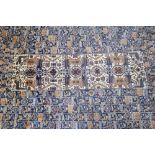 A Belouch large rug, the tribal design of stylised figures,