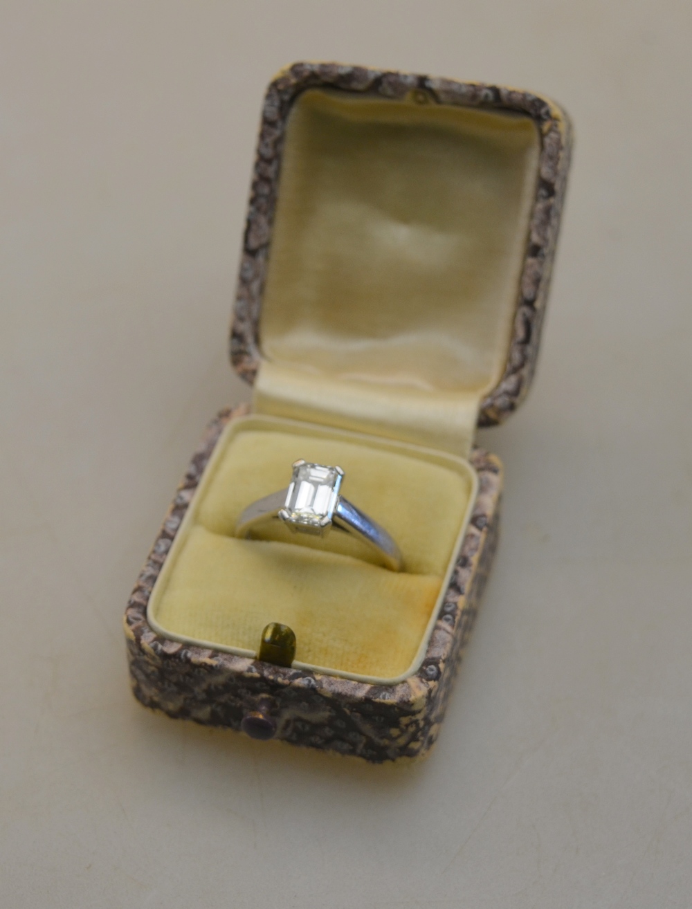 A single stone emerald cut diamond ring in 950 platinum four claw setting c/w GIA certificate