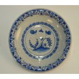 A Delft bowl decorated to the centre with fighting cockerels,