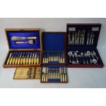A Victorian mahogany-cased set of twelve each dessert knives and forks and an inlaid walnut canteen
