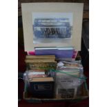 A quantity of books, pamphlets and vintage photographs on the subject of transport, including ships,