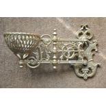 A cast iron Victorian style hanging wall bracket with hinged arm to a lattice form bowl - later