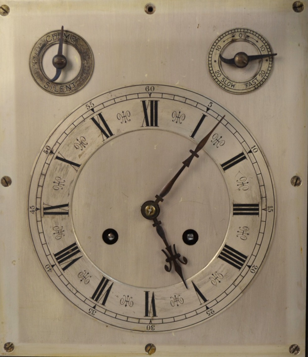 An early 20th century walnut cased eight-day mantel clock with silvered dial incorporating a - Image 2 of 5